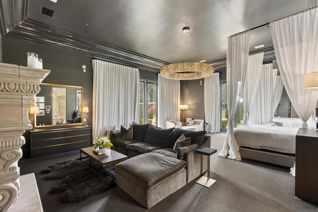 6853 Rancho Valencia Road Rancho Santa Fe, CA 92067 - Photo 13 of 40 a living room with furniture and a large window