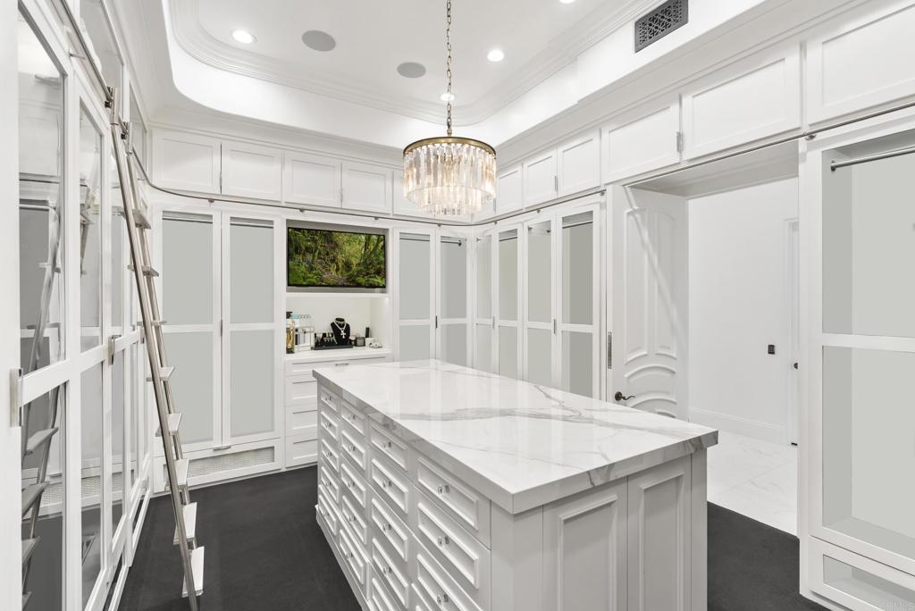 6853 Rancho Valencia Road Rancho Santa Fe, CA 92067 - Photo 17 of 40 a very nice looking dining room with a chandelier