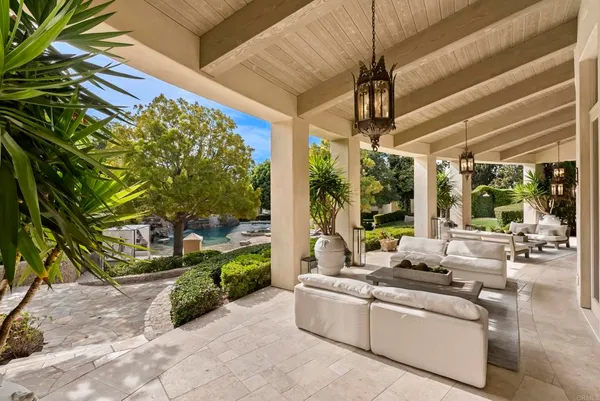 a building outdoor space with patio furniture and garden