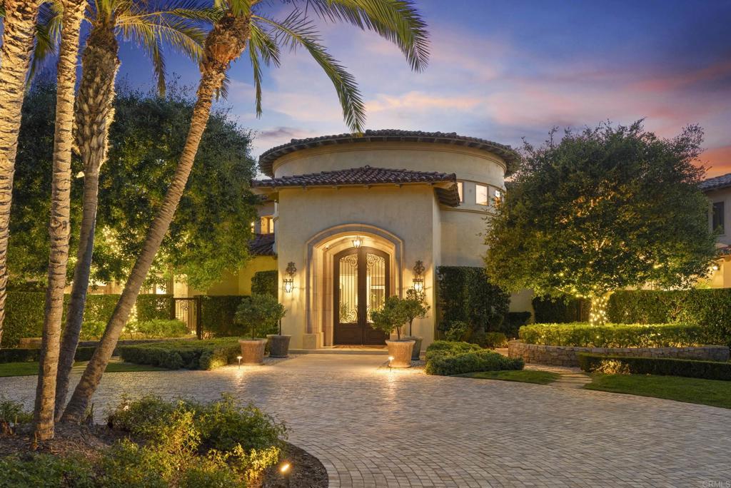 6853 Rancho Valencia Road Rancho Santa Fe, CA 92067 - Photo 2 of 40 a view of a house with a yard