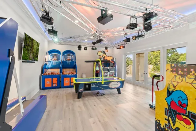 a living room with furniture and a book shelf