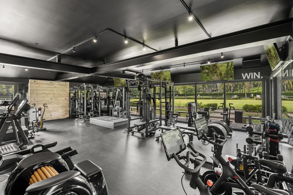 6853 Rancho Valencia Road Rancho Santa Fe, CA 92067 - Photo 30 of 40 a view of a room with gym equipment