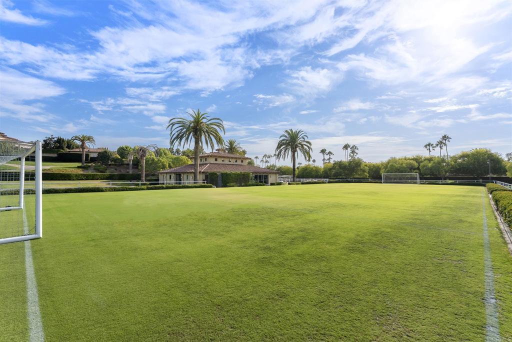 6853 Rancho Valencia Road Rancho Santa Fe, CA 92067 - Photo 33 of 40 a view of a lake with a big yard
