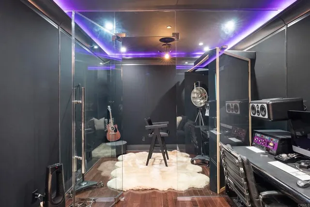 a view of a patio with couches table and chairs and potted plants