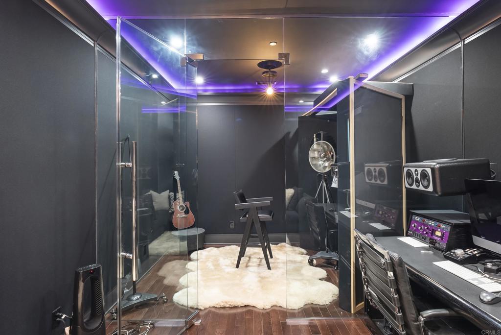 6853 Rancho Valencia Road Rancho Santa Fe, CA 92067 - Photo 35 of 40 a room with lots of gym equipment