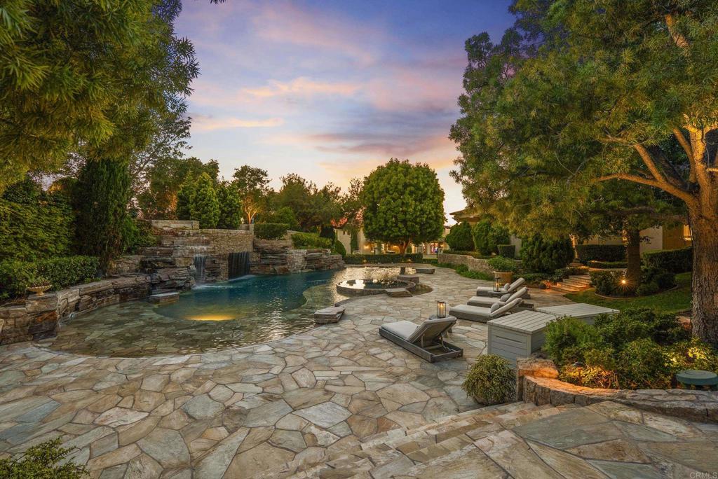 6853 Rancho Valencia Road Rancho Santa Fe, CA 92067 - Photo 37 of 40 a view of swimming pool with lawn chairs and plants
