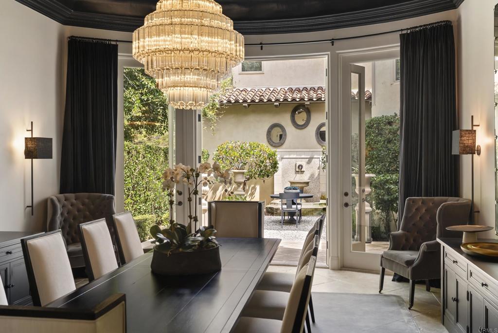 6853 Rancho Valencia Road Rancho Santa Fe, CA 92067 - Photo 6 of 40 a living room with furniture and a large window