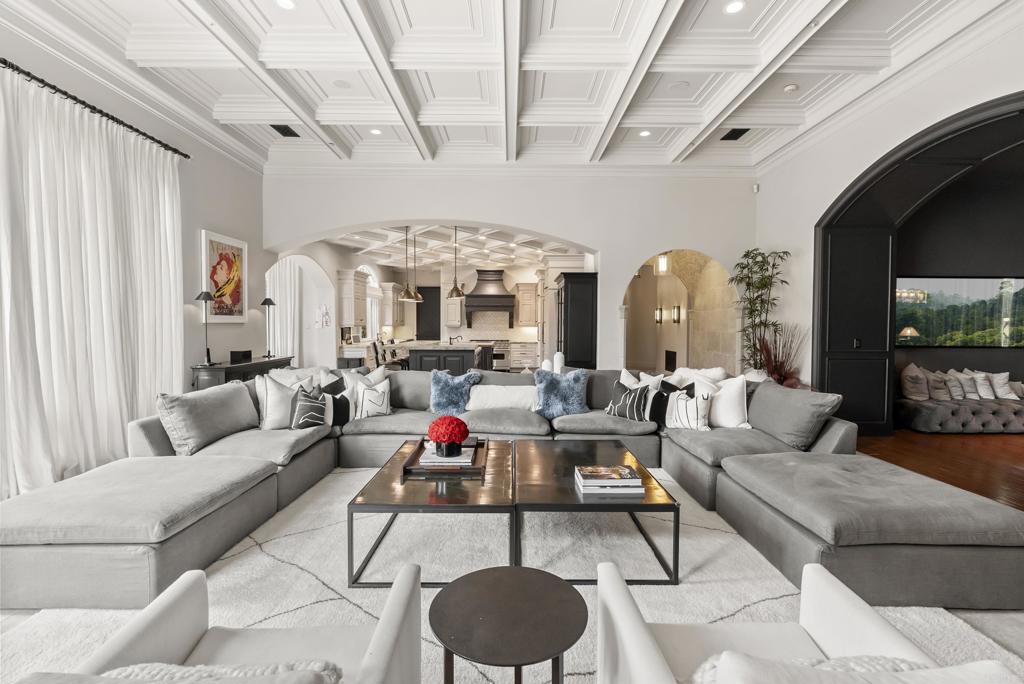 6853 Rancho Valencia Road Rancho Santa Fe, CA 92067 - Photo 8 of 40 a living room with furniture and a chandelier