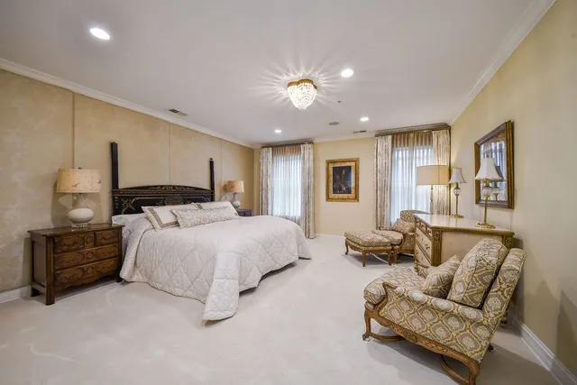 a spacious bedroom with a bed and furniture