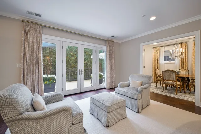a living room with furniture and a large window with outer view