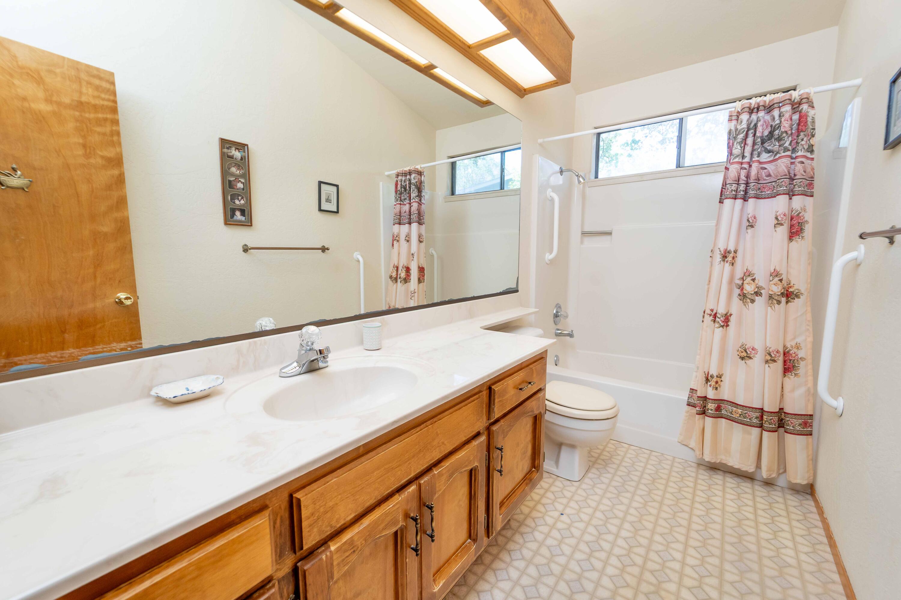 40962 Oak Ridge Drive Three Rivers, CA 93271 - Photo 19 of 36 a bathroom with a sink a toilet and shower