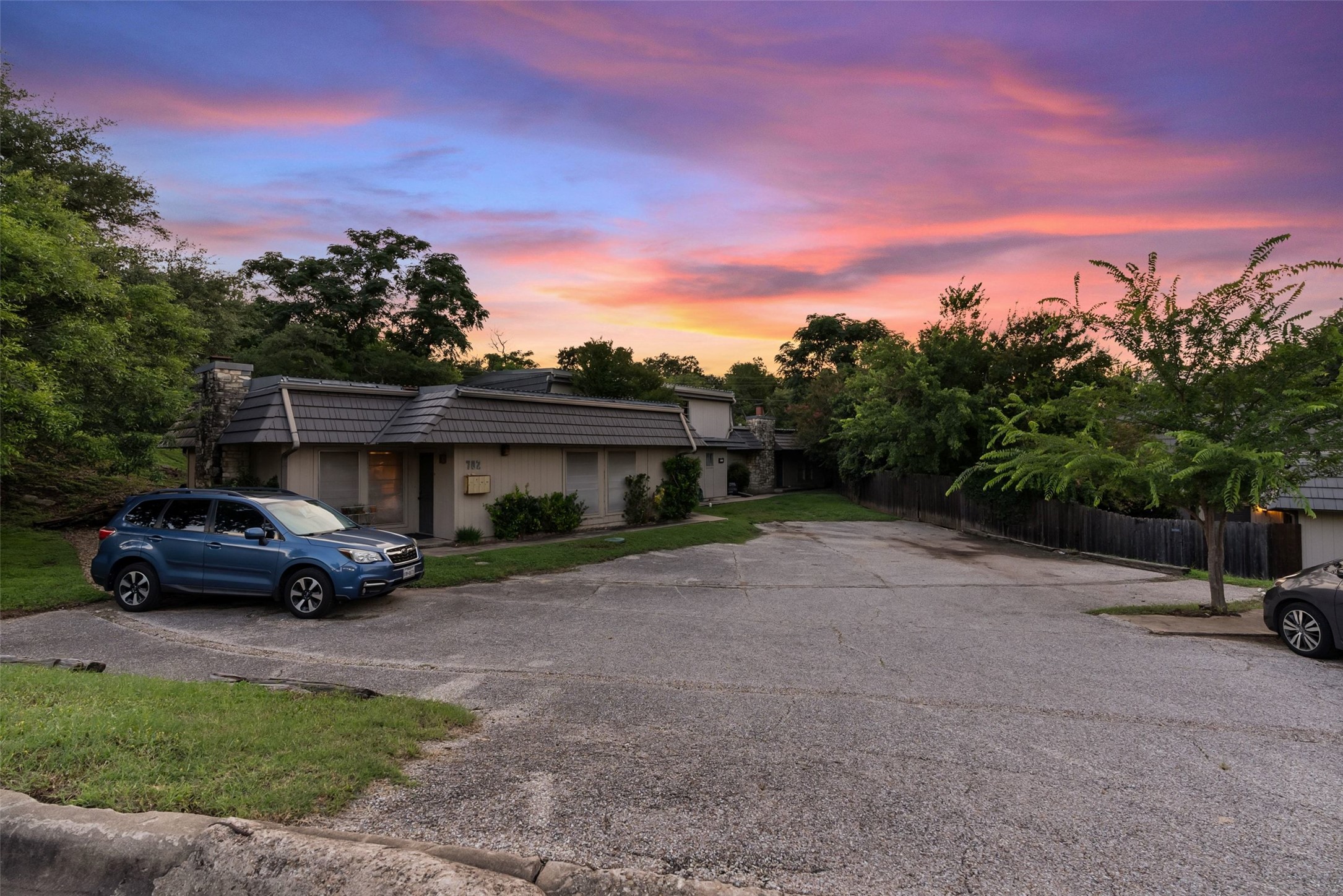 702 Castle Ridge Road, Unit C Austin, TX 78746 - Photo 2 of 36 Additional highlights include abundant unassigned off-street parking just outside the front door and low-maintenance living in a prime central location.