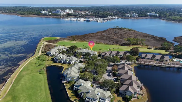 an aerial view of a house with a lake view