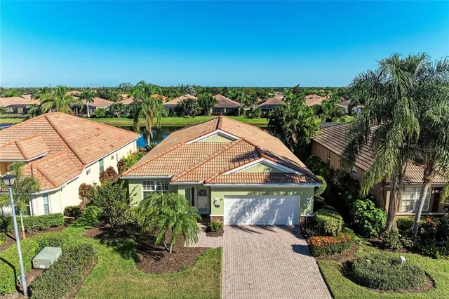 an aerial view of a house with a ocean view