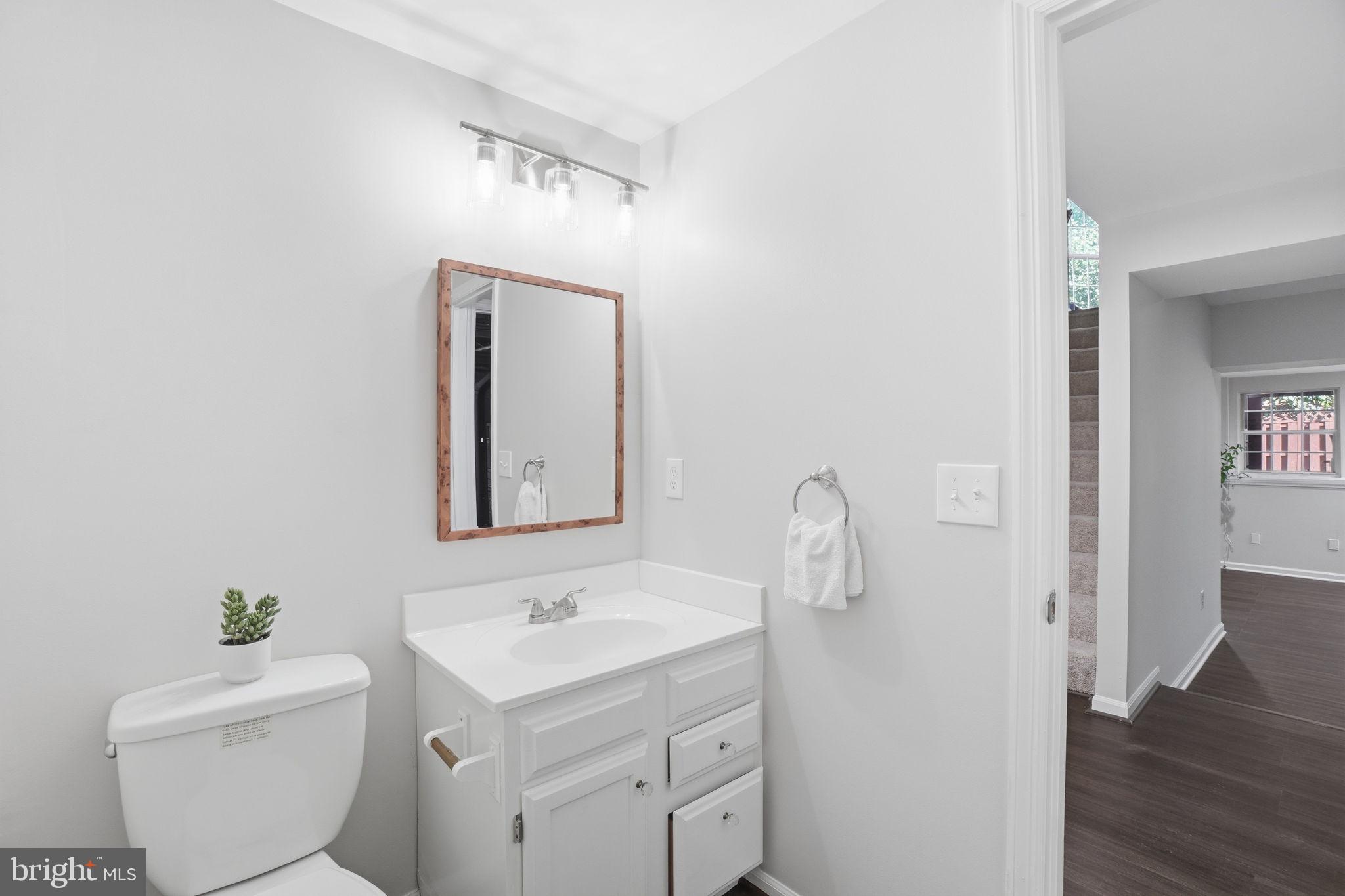 6010 Bingley Road Alexandria, VA 22315 - Photo 39 of 50 a bathroom with a toilet sink and mirror