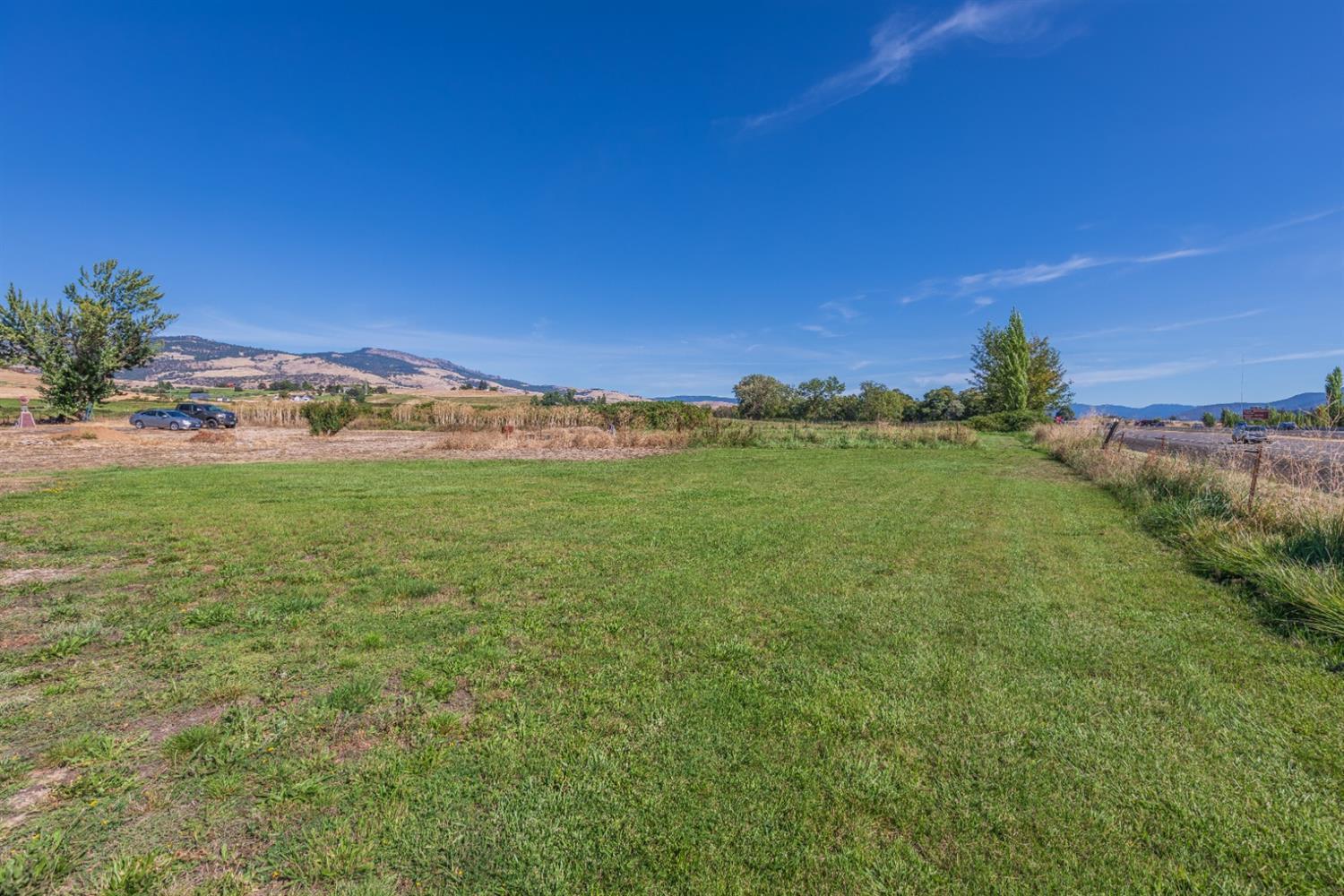 728 West Valley View Road Ashland, OR 97520 - Photo 11 of 32 a view of a field with an ocean