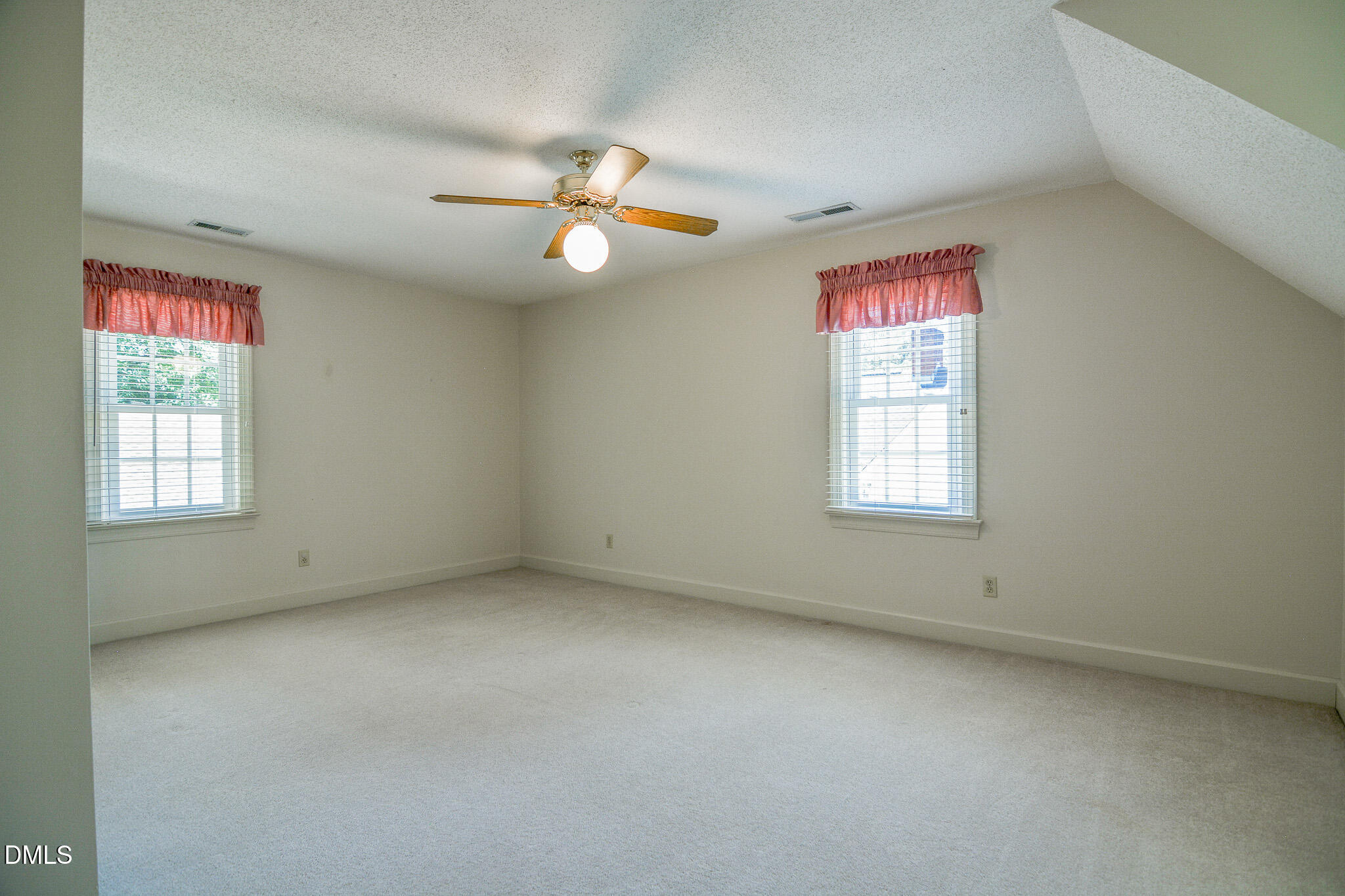 1215 Cambridge Road Northwest Wilson, NC 27896 - Photo 46 of 54 an empty room with windows and fan