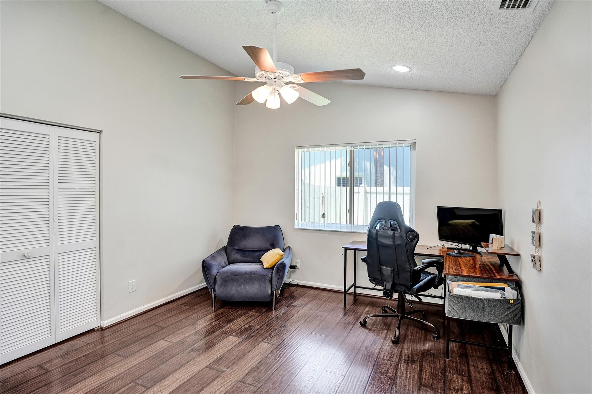 10130 Northwest 13th Street Plantation, FL 33322 - Photo 11 of 23 a view of a workspace with furniture and a window