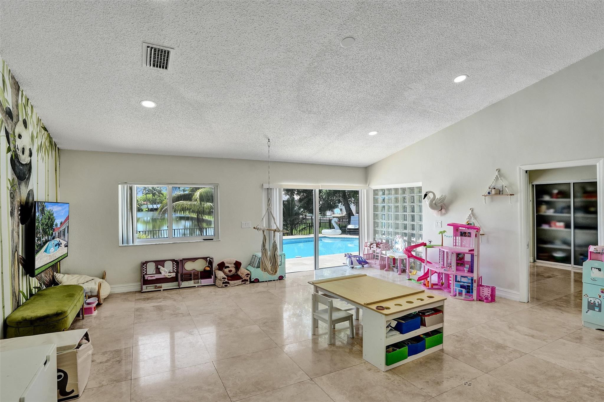 10130 Northwest 13th Street Plantation, FL 33322 - Photo 14 of 23 a living room with furniture and a flat screen tv