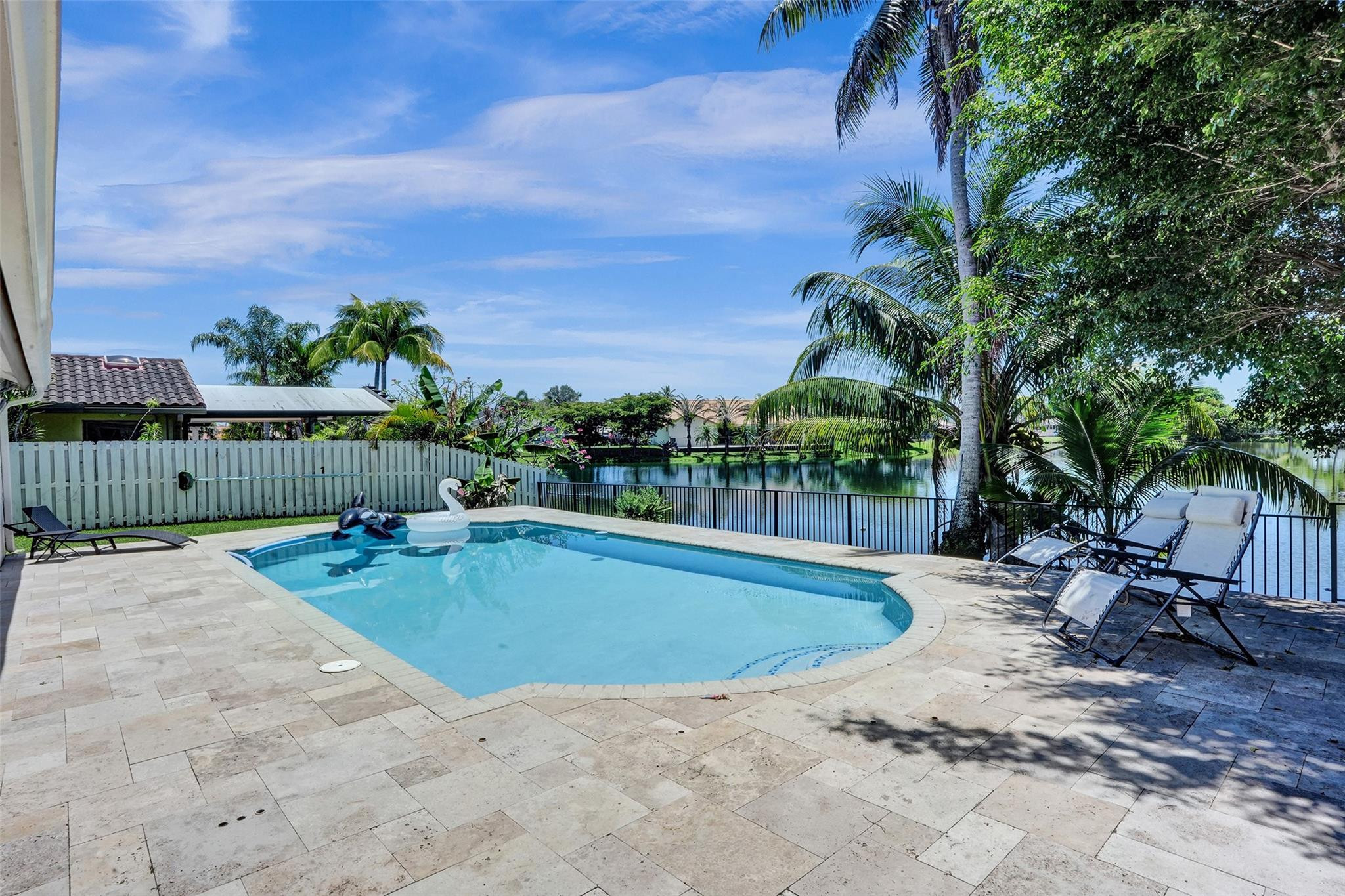 10130 Northwest 13th Street Plantation, FL 33322 - Photo 17 of 23 a view of a swimming pool with a lounge chairs