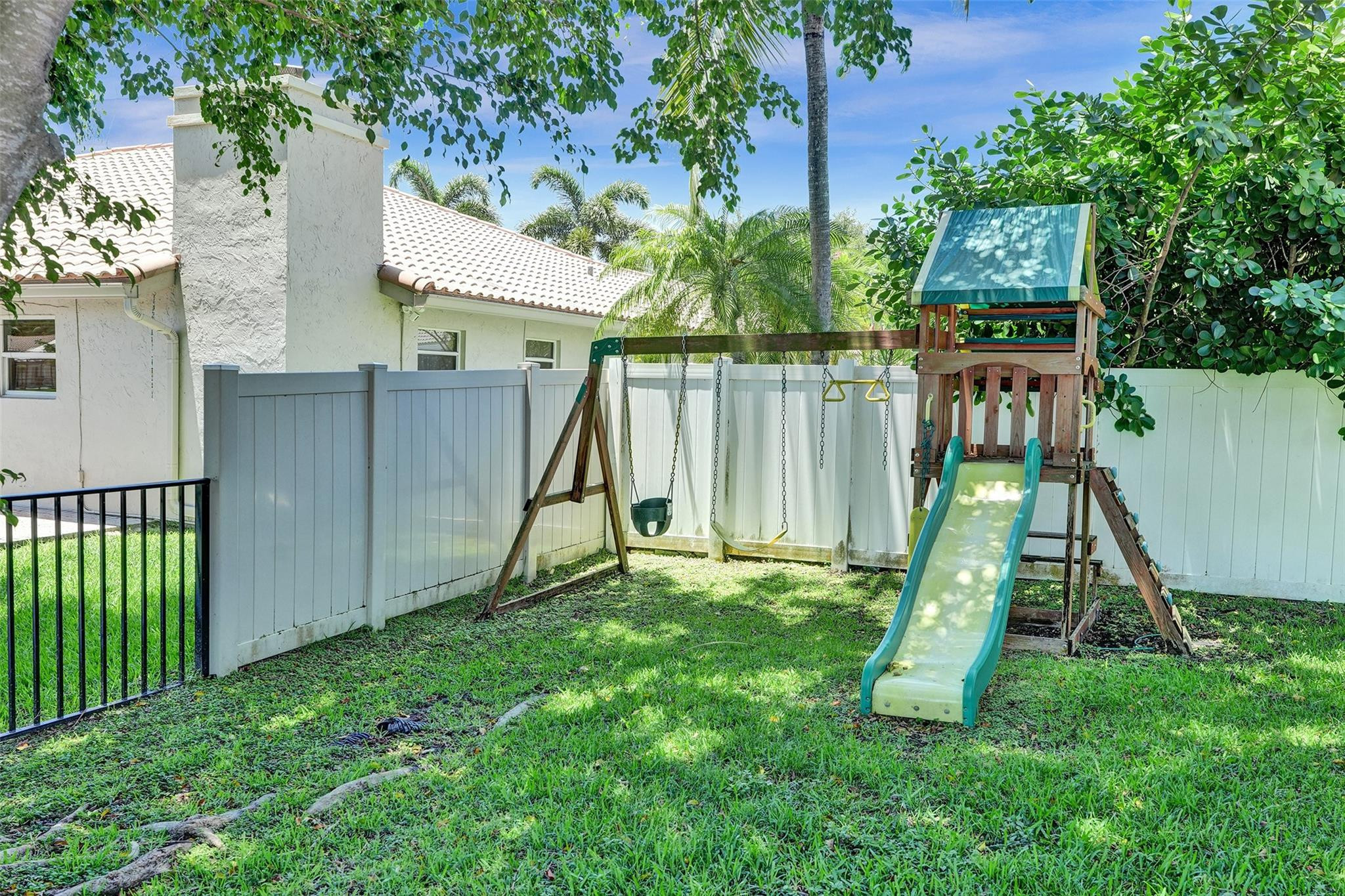 10130 Northwest 13th Street Plantation, FL 33322 - Photo 20 of 23 a view of a backyard with a slide
