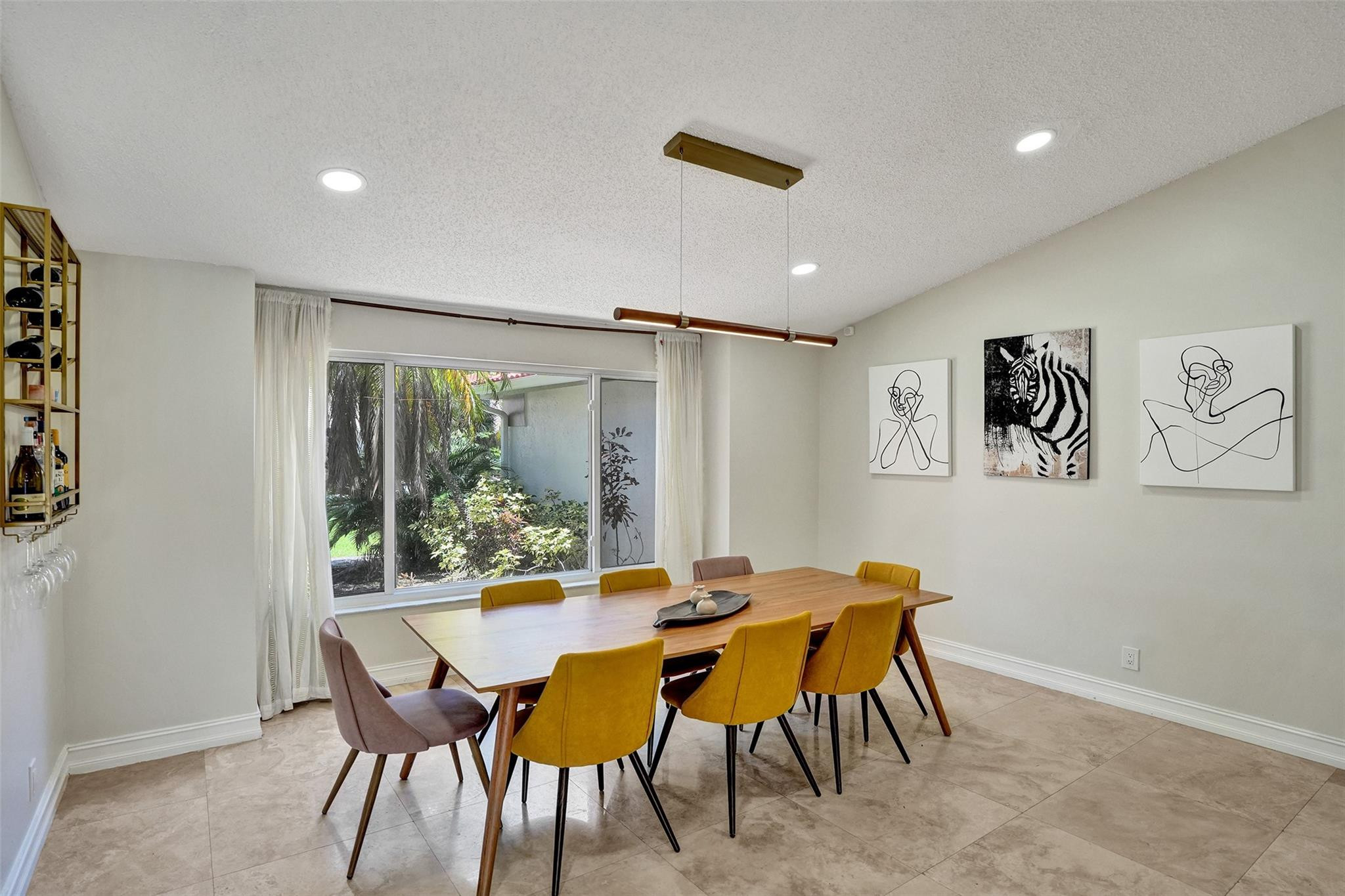 10130 Northwest 13th Street Plantation, FL 33322 - Photo 4 of 23 a view of a dining room with furniture and a large window