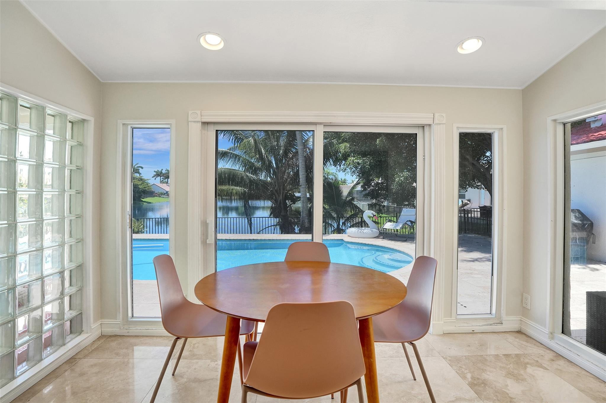 10130 Northwest 13th Street Plantation, FL 33322 - Photo 5 of 23 a view of a dining room with furniture window and wooden floor