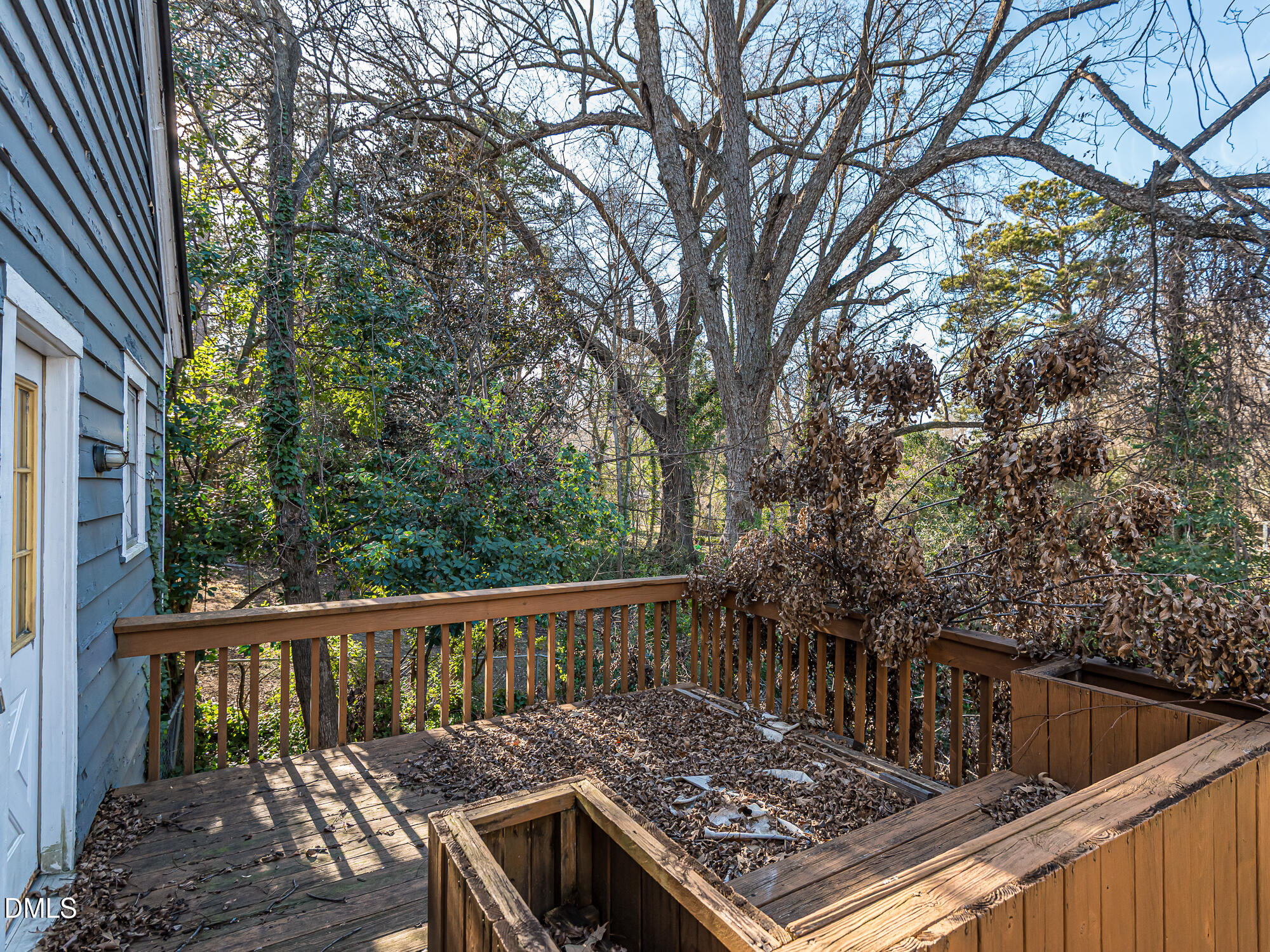 1825 White Oak Road Raleigh, NC 27608 - Photo 12 of 35 a view of balcony with wooden floor and fence