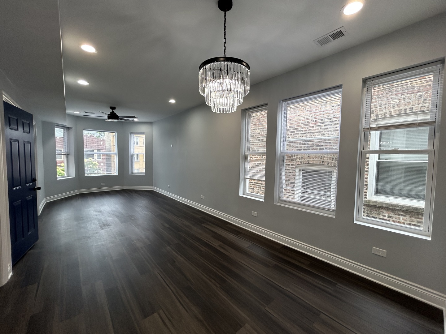 7940 South Carpenter Street, Unit 2 Chicago, IL 60620 - Photo 15 of 34 a view of an empty room with wooden floor and a window