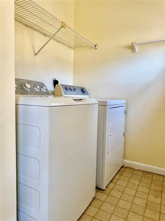 2735 Southwest 35th Place, Unit 1604 Gainesville, FL 32608 - Photo 15 of 25 a utility room with dryer and washer