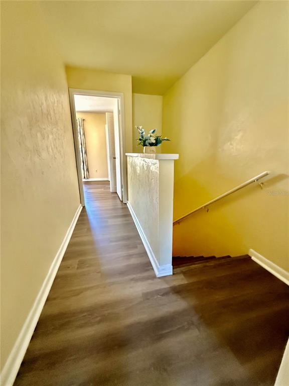 2735 Southwest 35th Place, Unit 1604 Gainesville, FL 32608 - Photo 21 of 25 a view of a room with wooden floor