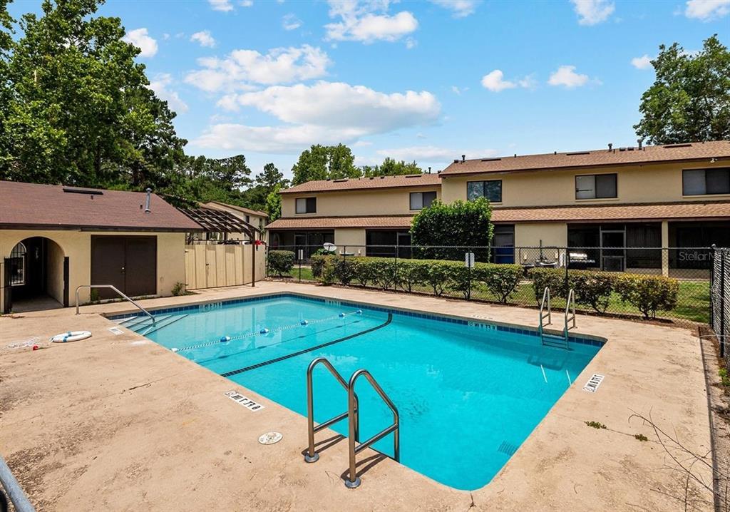 2735 Southwest 35th Place, Unit 1604 Gainesville, FL 32608 - Photo 25 of 25 a view of a house with swimming pool and sitting area