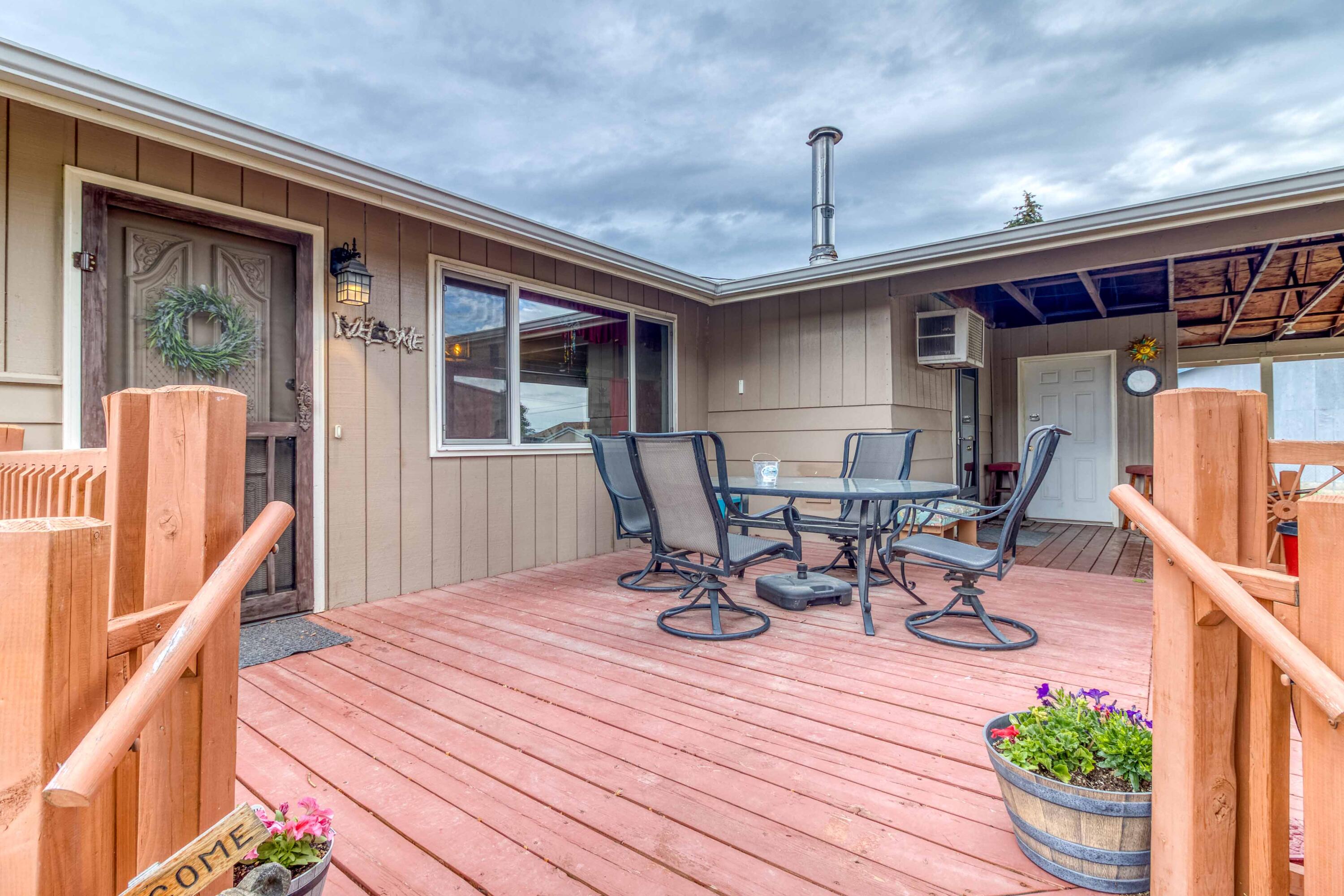 566 Northwest Mc Donald Road Prineville, OR 97754 - Photo 5 of 41 a view of a wooden chairs and table in a patio