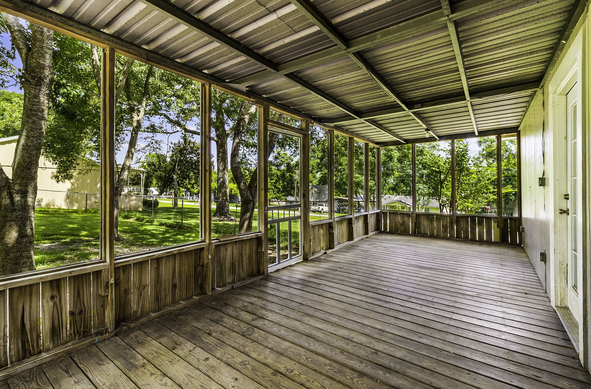 51 Rustling Oaks Coldspring, TX 77331 - Photo 9 of 43 This screen in patio is located just off the dining room area, overlooking side lot 16