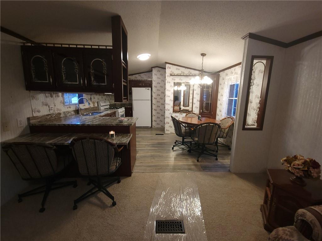 28 K And L Lane Butler, PA 16001 - Photo 11 of 18 a view of a dining room with furniture and chandelier
