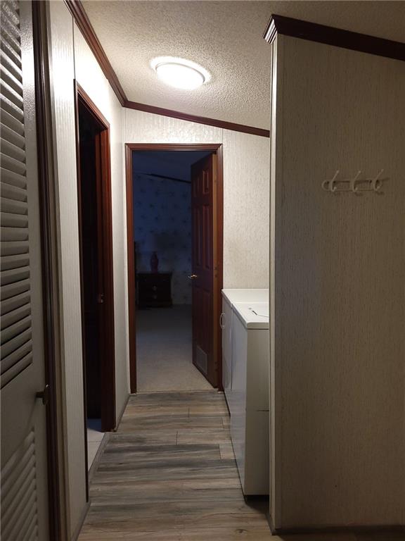 28 K And L Lane Butler, PA 16001 - Photo 14 of 18 a view of a hallway with wooden floor and staircase