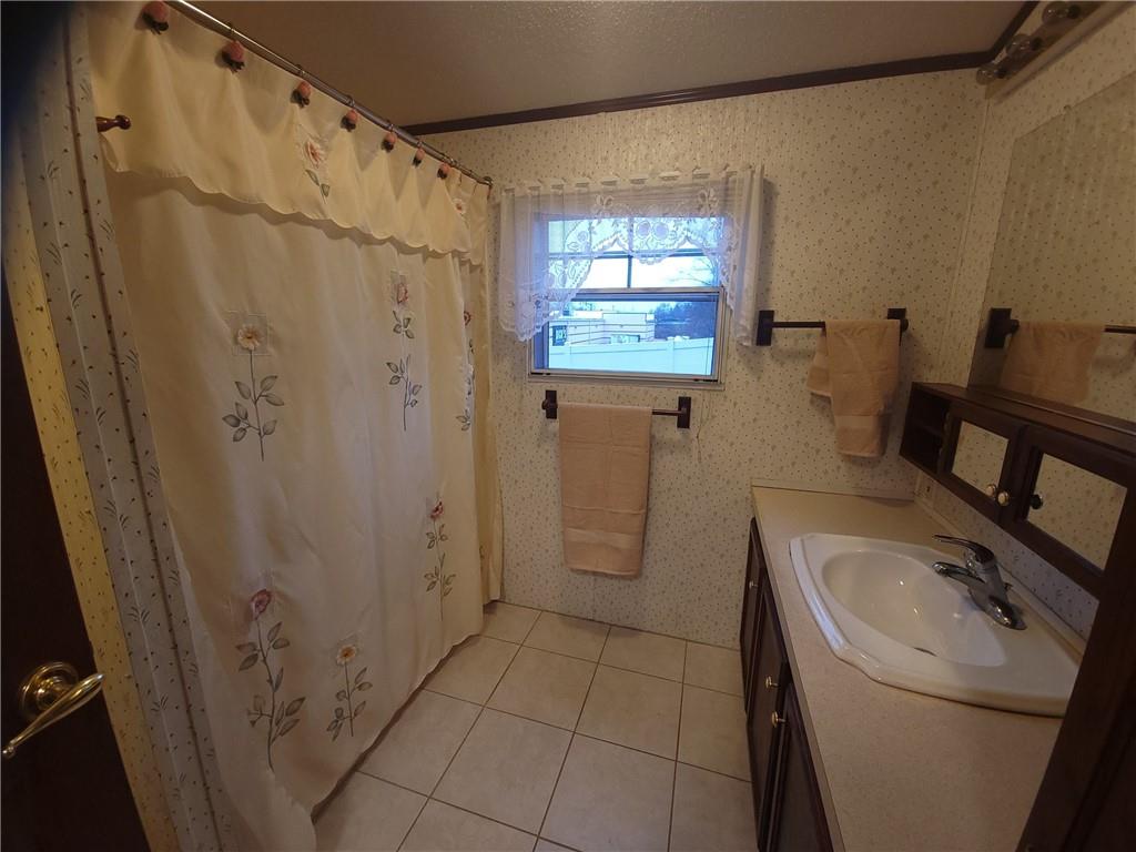 28 K And L Lane Butler, PA 16001 - Photo 16 of 18 a bathroom with a sink a toilet and a shower