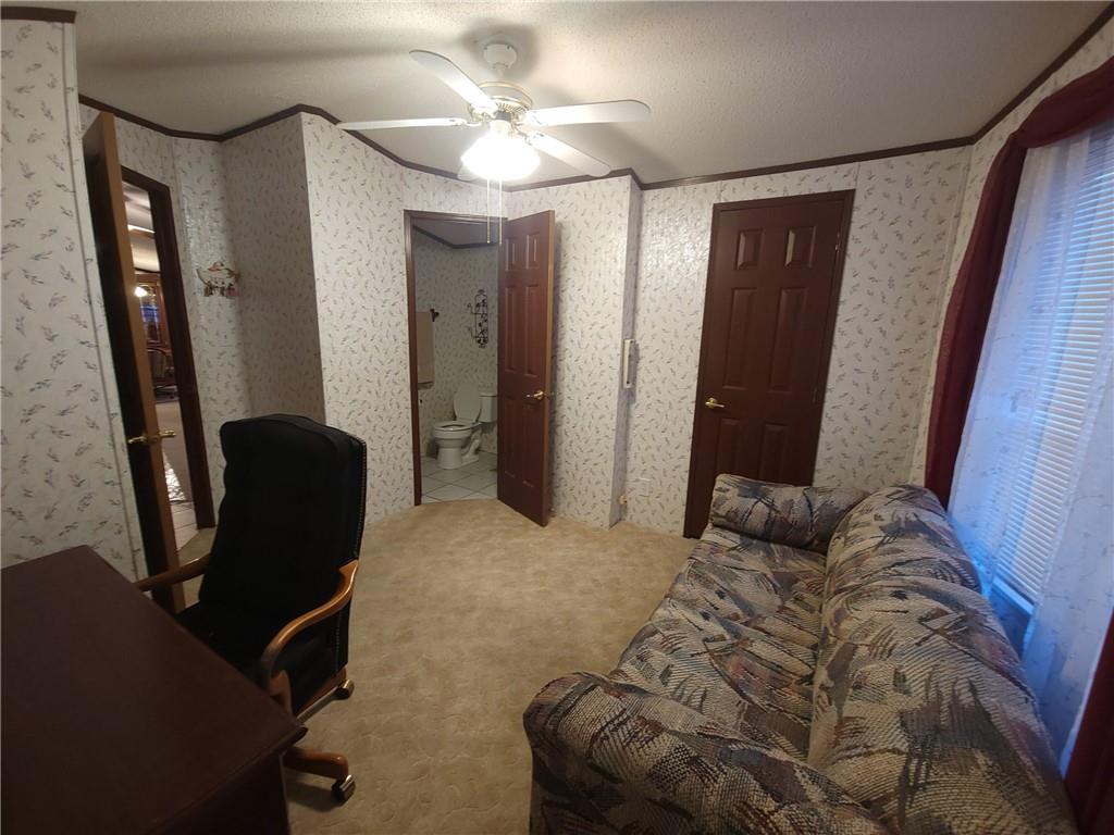 28 K And L Lane Butler, PA 16001 - Photo 7 of 18 a bedroom with a bed and a mirror