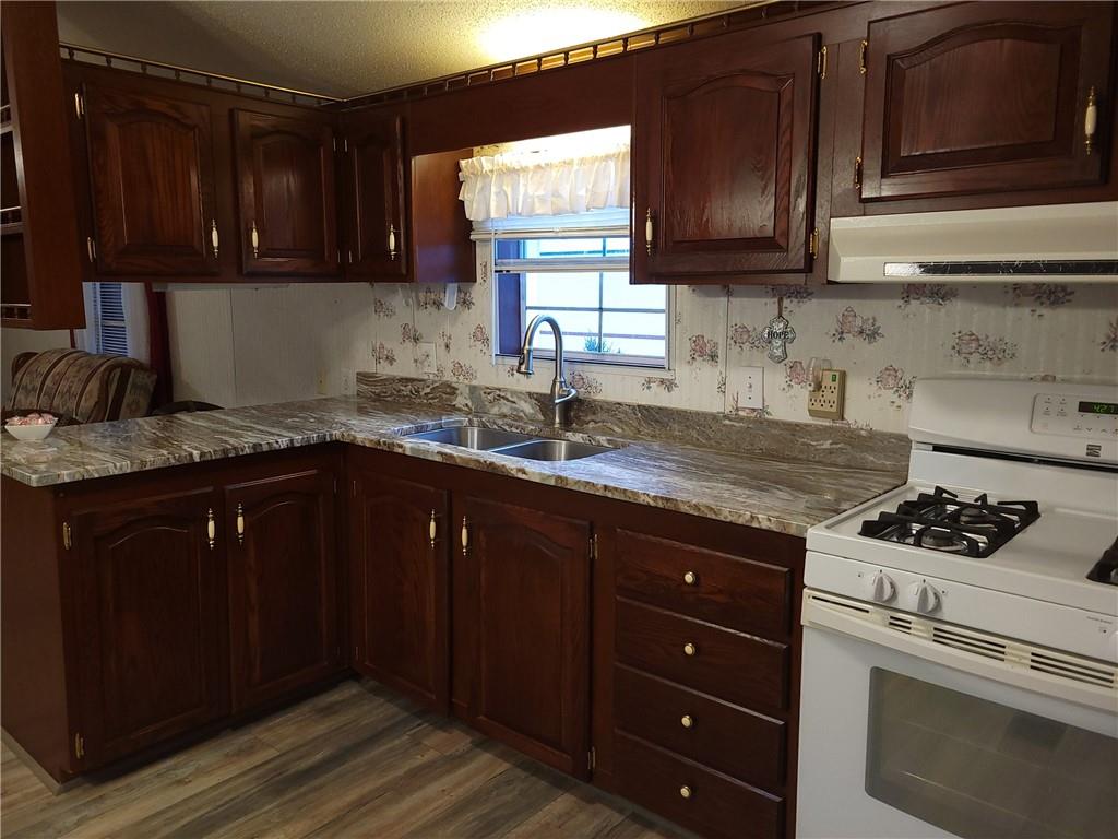 28 K And L Lane Butler, PA 16001 - Photo 10 of 18 a kitchen with granite countertop a sink cabinets and stainless steel appliances