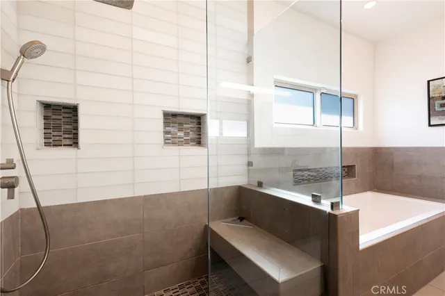 a bathroom with a shower and a sink