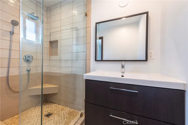 a bathroom with a sink and mirror