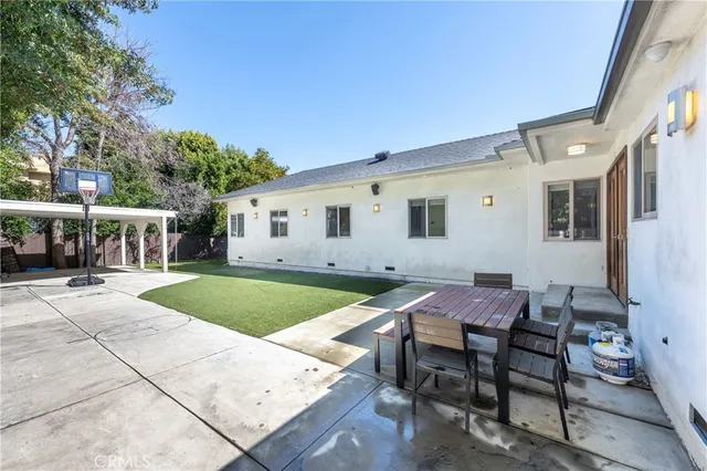 a patio with table and chairs
