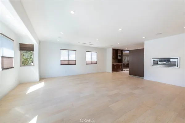 a view of a big room with windows and closet