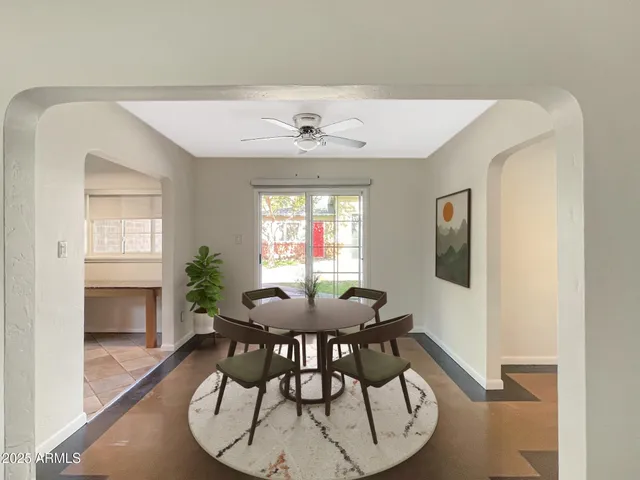 a view of a dining room with furniture and window