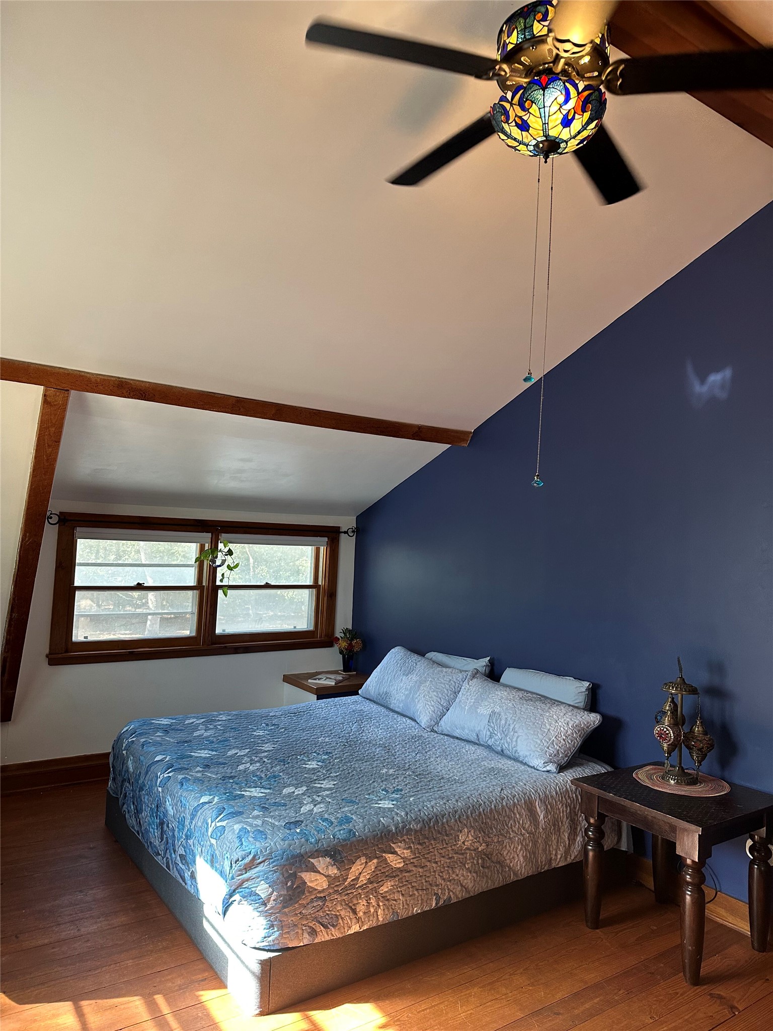 1053 East County Rd F Lexington, TX 78947 - Photo 16 of 38 a bedroom with a bed table and window