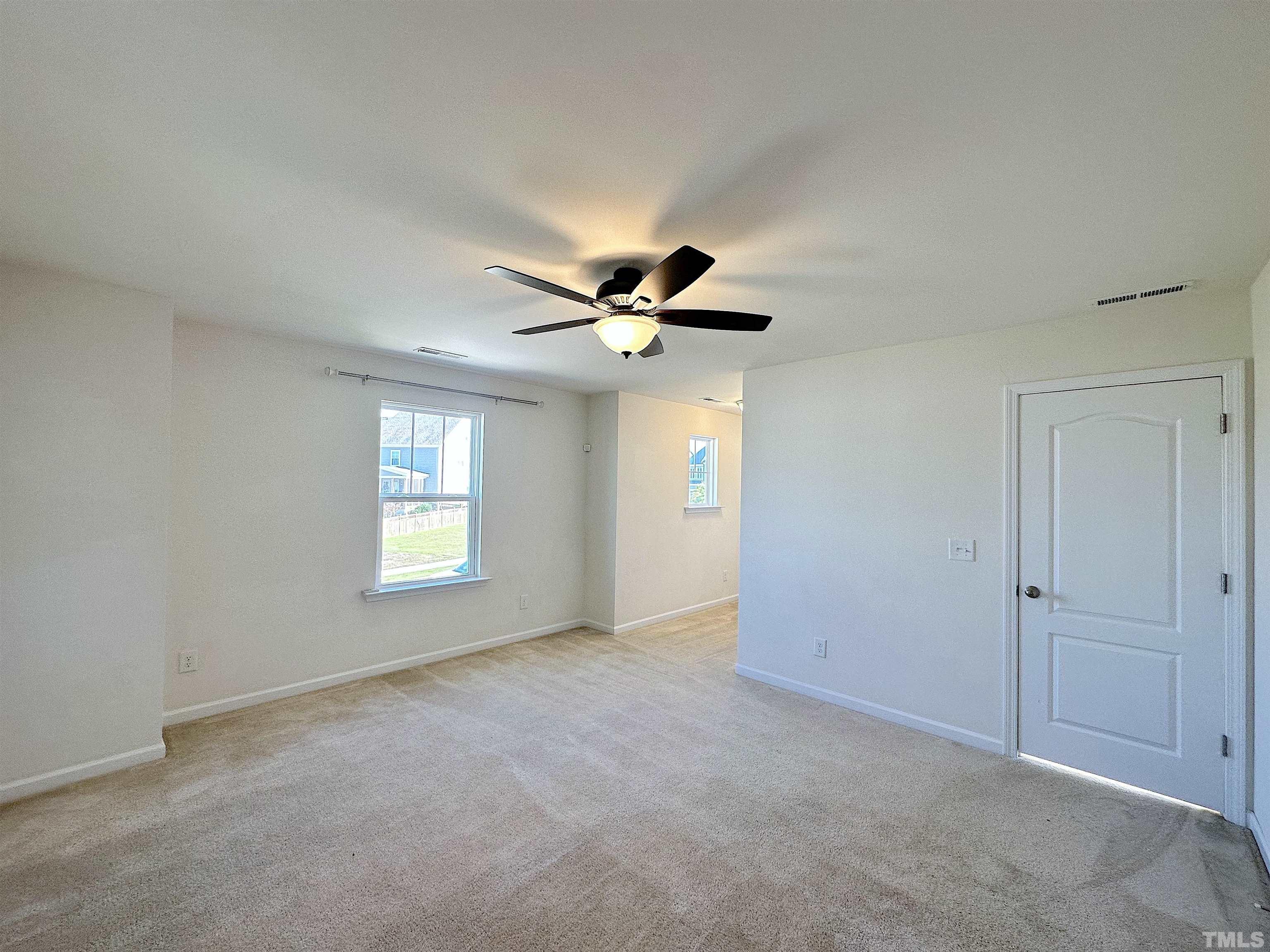 205 Azalea View Way Holly Springs, NC 27540 - Photo 15 of 29 a view of an empty room with a window
