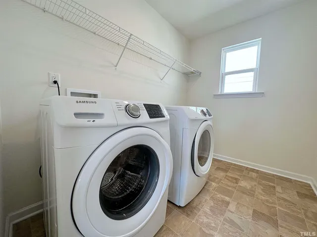 a utility room with dryer and washer