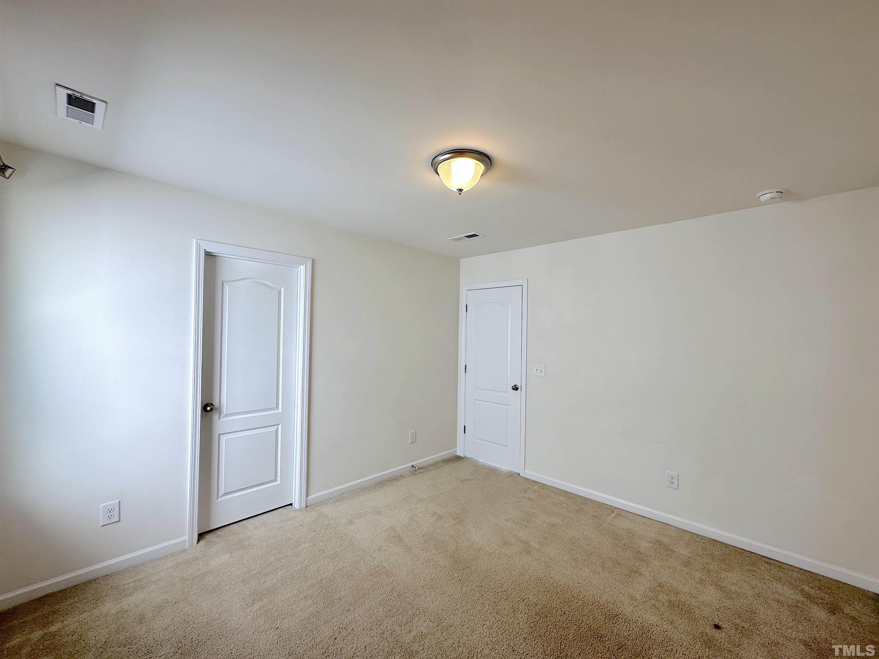 205 Azalea View Way Holly Springs, NC 27540 - Photo 23 of 29 a view of an empty room
