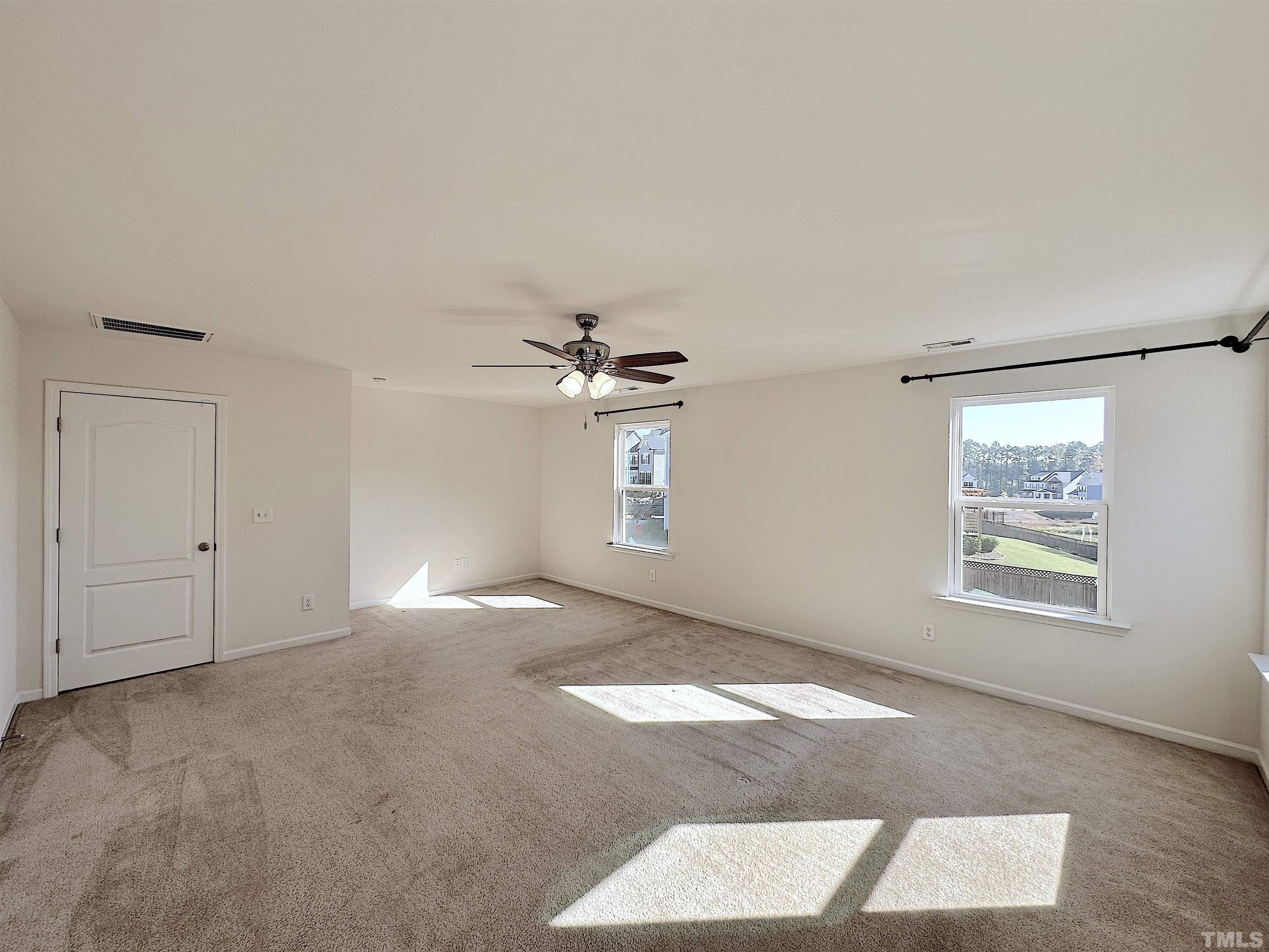 205 Azalea View Way Holly Springs, NC 27540 - Photo 24 of 29 a view of an empty room with a window