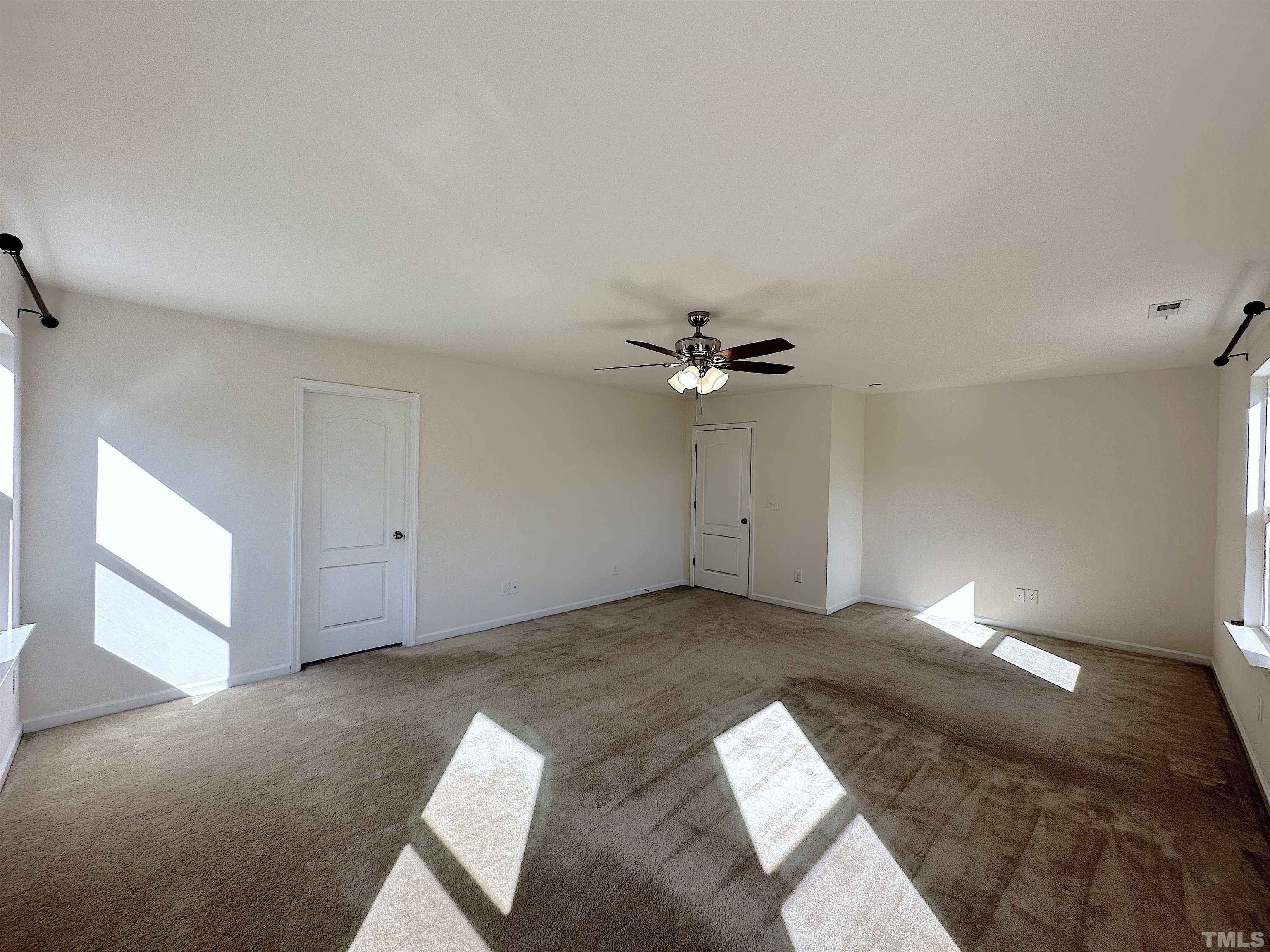 205 Azalea View Way Holly Springs, NC 27540 - Photo 25 of 29 a view of empty room with windows